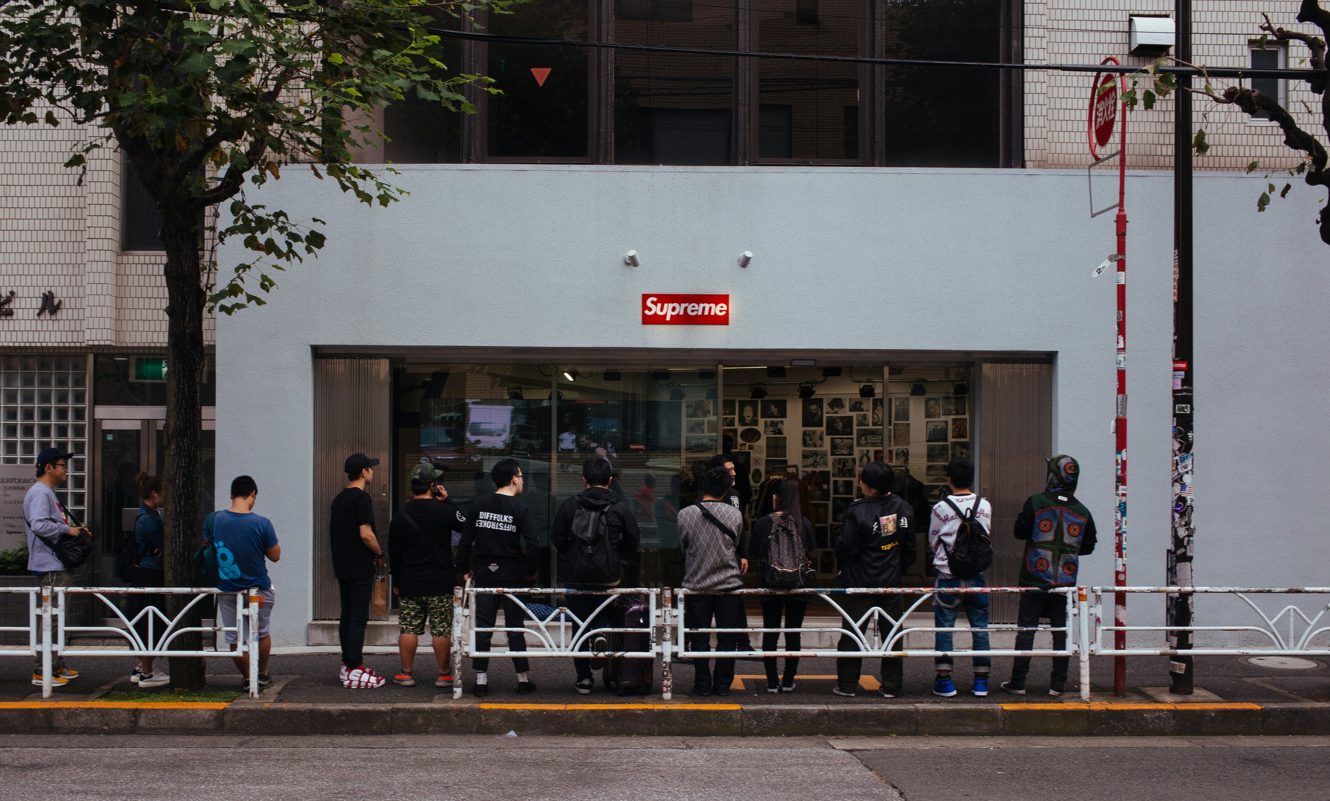 people in line in front of Supreme store